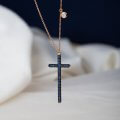 Blue sapphire long cross pendant with one diamond