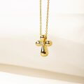 Curved gold cross with a diamond