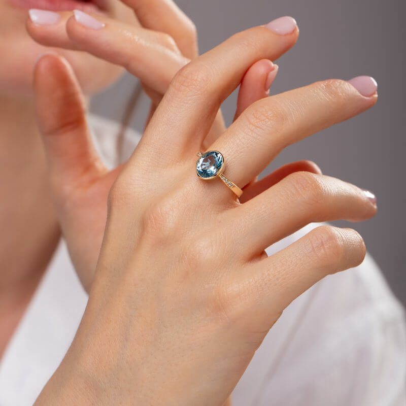 Blue topaz ring with diamonds