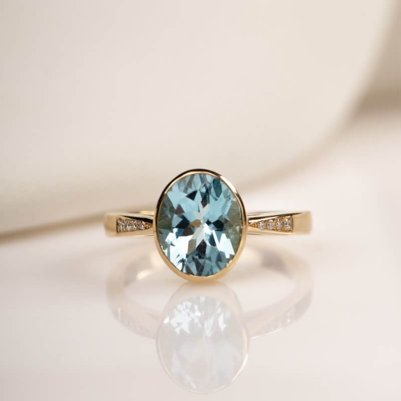 Blue topaz ring with diamonds