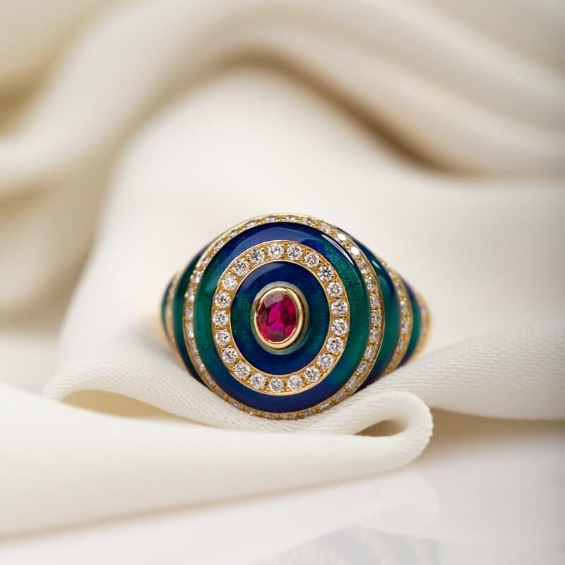 Enameled ring with an oval ruby and diamonds