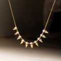 Pearls and golden spikes necklace