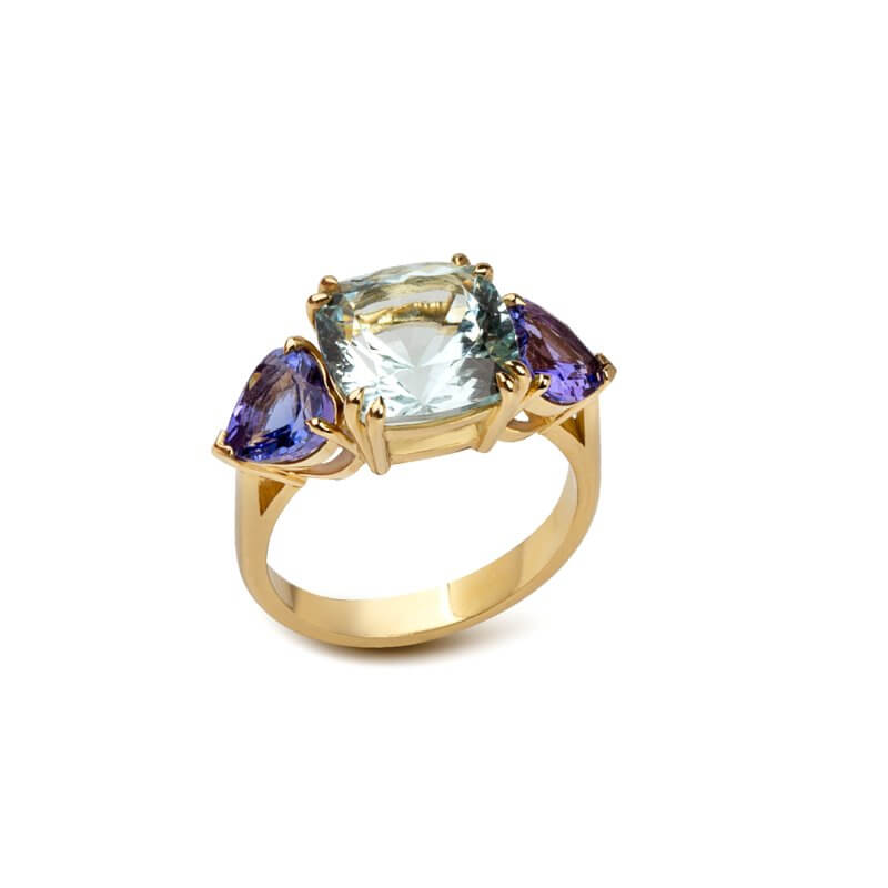 Three-stone ring with aquamarine and tanzanites