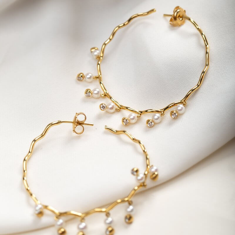 Wavy hoops with dangling pearls and diamonds